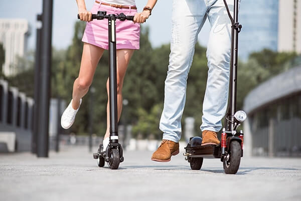 People riding an electric scooter