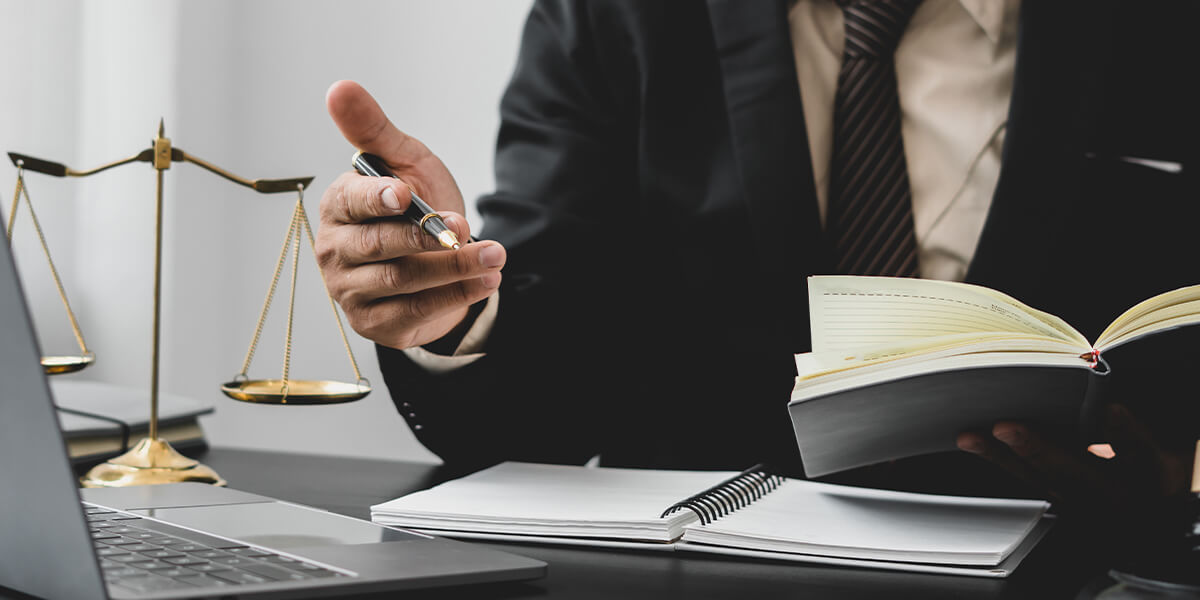 Scale of justice and a lawyer