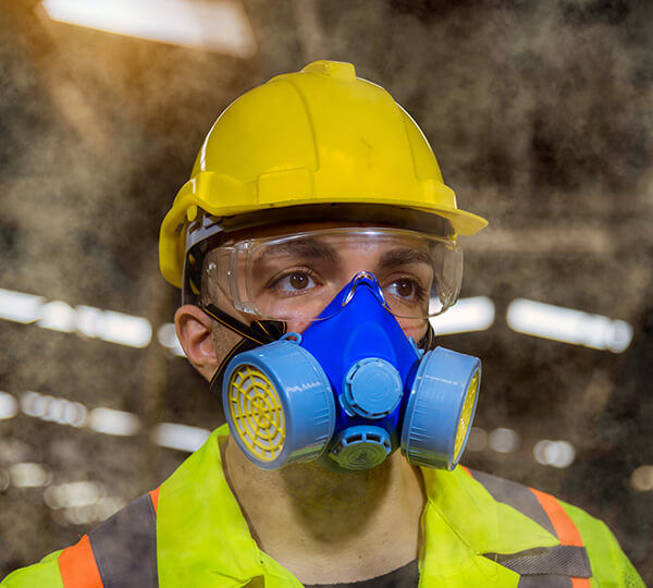 A Engineer industry wearing safety uniform ,black gloves ,gas mask