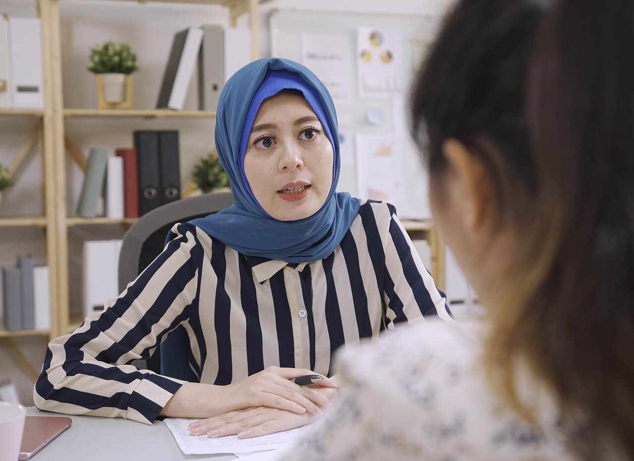 Muslim woman in a meeting with a client