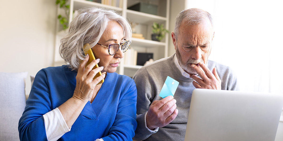 Worried senior couple making enquiries about potential misuse of their private information.